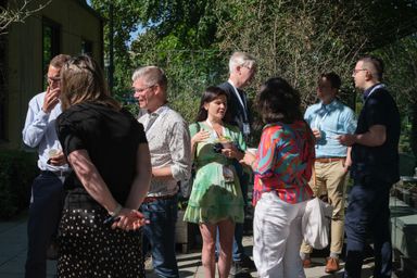 Group of guests enjoying outdoor fika conversations at myConf 2024.