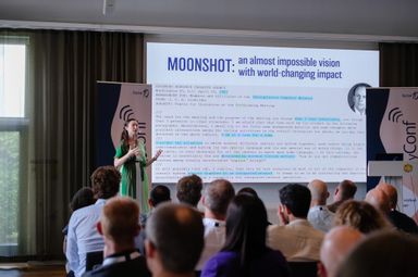 Tamara Carleton delivering a keynote on moonshot ideas at myConf 2024.