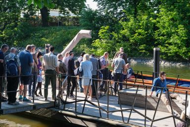 Guests boarding a boat for a guided tour at myConf 2024.