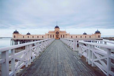 white wooden bridge under white sky during daytime